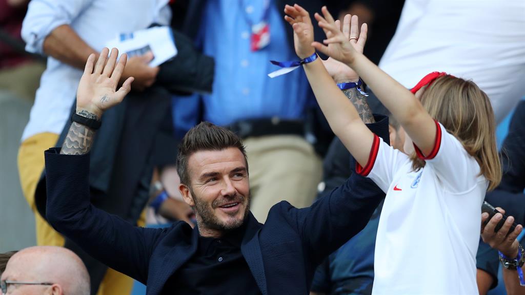 Becks’ Mex: Harper and her dad joining the Mexican wave in the stand, and tucking in to a packet of M&M sweets