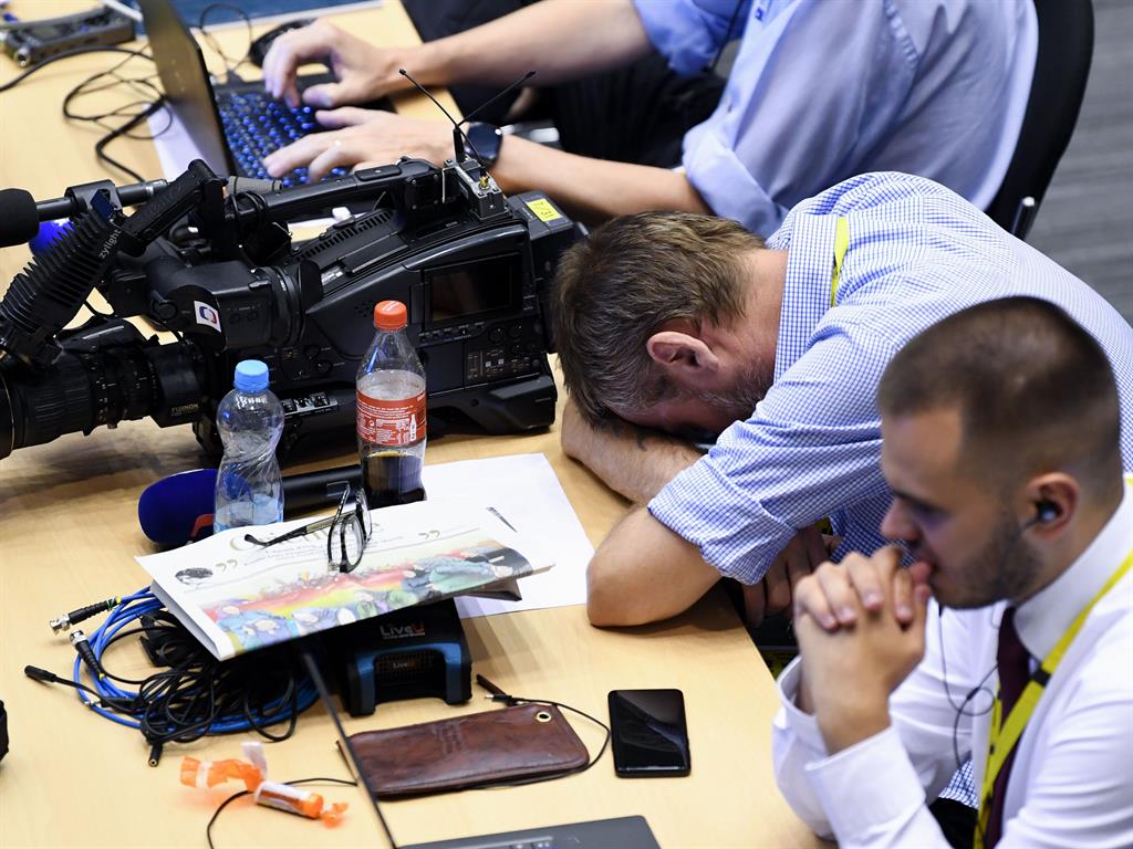 Sleeping forecast: A reporter rests his head
