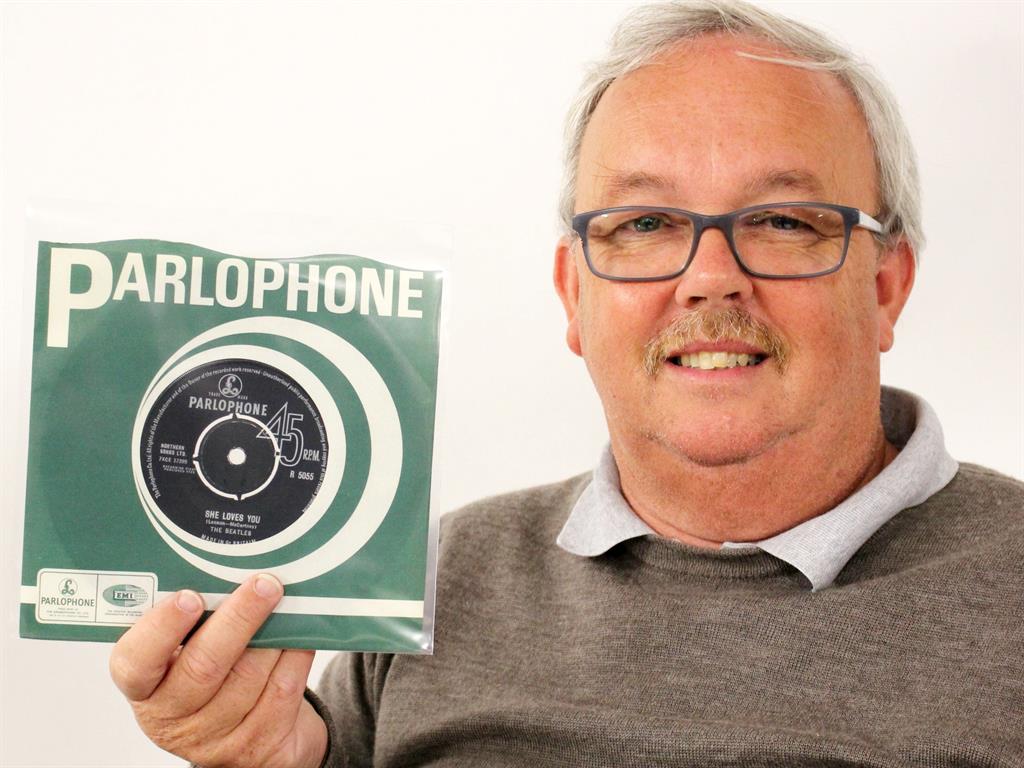 Beatlemania: Tim Claydon with the disc that kick-started his collection of 684 vinyl records PICTURES: SWNS