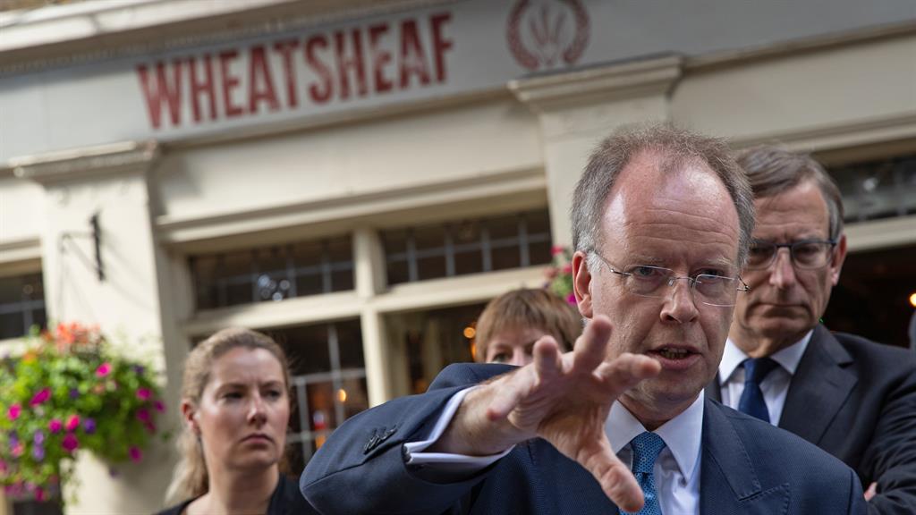 In footsteps: Chief coroner Mark Lucraft outside the Wheatsheaf pub as he leads jurors along Stoney Street in Borough Market