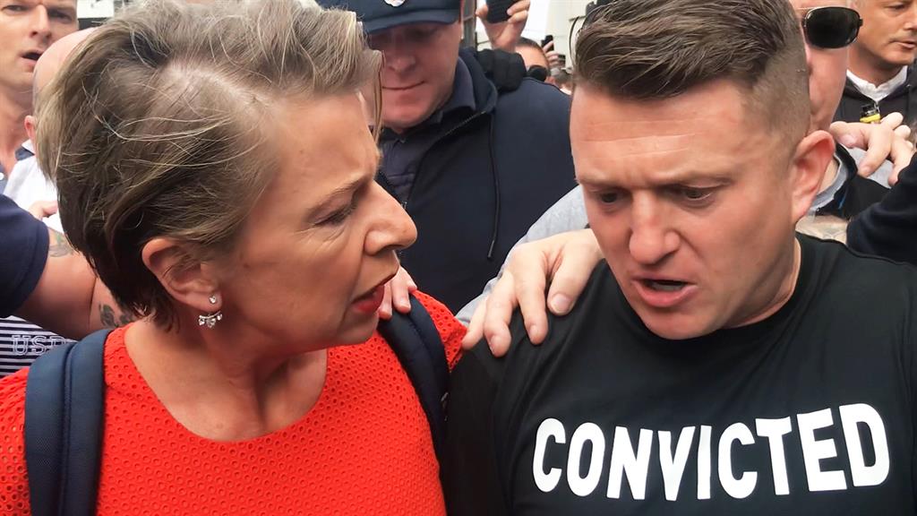 Mobbed: Robinson arrives at court accompanied by far-right commentator Katie Hopkins