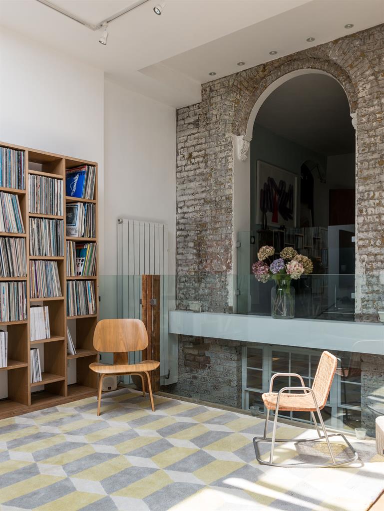 Outside in: The original frontage — including the stone steps — is now an internal feature. Below: The marble wet room with skylight