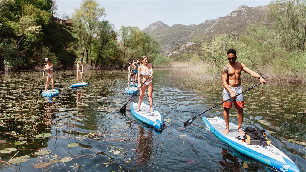 Oar-inspiring: Rock up to the sights on a paddleboard or down a sample or three at the Castel Savina vineyard (below)