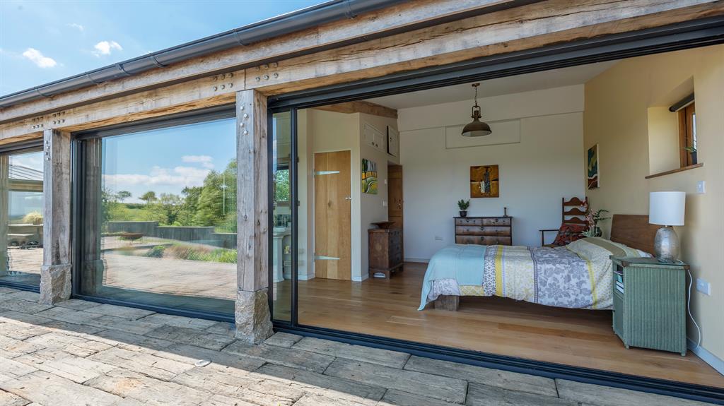Wake-up call: Even the bedroom doors open to the outside