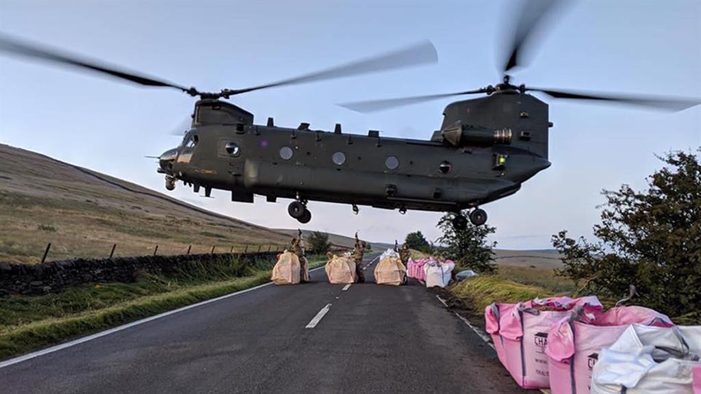 Drops: The RAF Chinook has made numerous journeys to the stricken dam wall PICTURE: RAF/MoD/PA