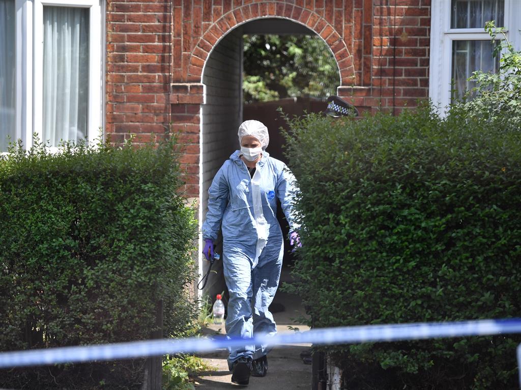 Investigation: A forensics officer at the scene PICTURE: PA