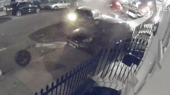 Smashing time: The Audi crashes into parked cars