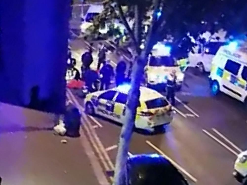 Help at hand: Emergency services assist Pc Stuart Outten in the immediate aftermath of the attack PICTURE: SWNS