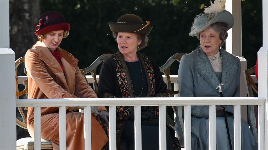 On set: Laura Carmichael, Imelda Staunton, Dame Maggie Smith between scenes on Downton Abbey The Movie PICTURE: REX