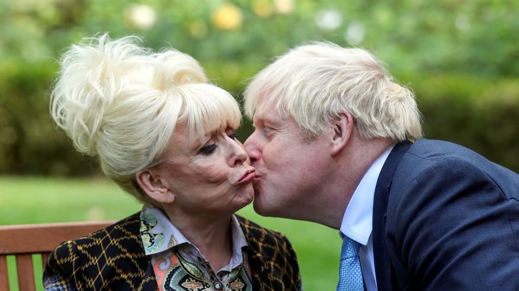 Kiss me quick The prime minister leans in to peck Dame Barbara on the cheek