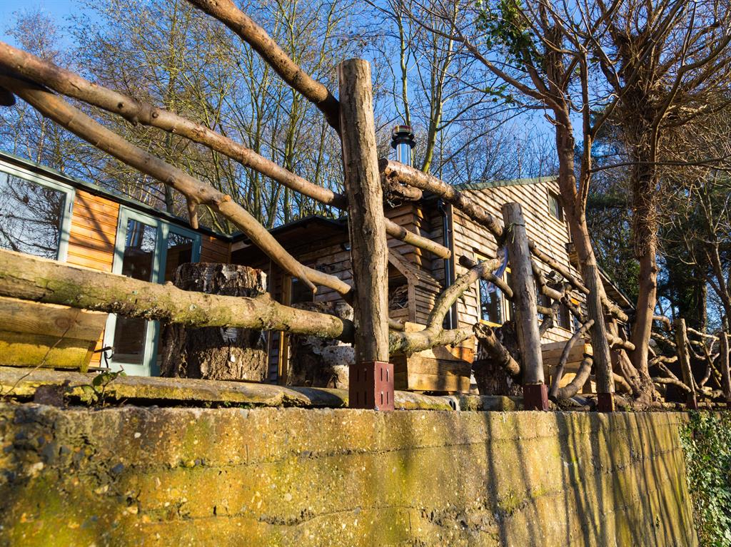 Artist's abode: The chalet is built from recycled materials including scaffolding planks, pallet crates and discarded caravans