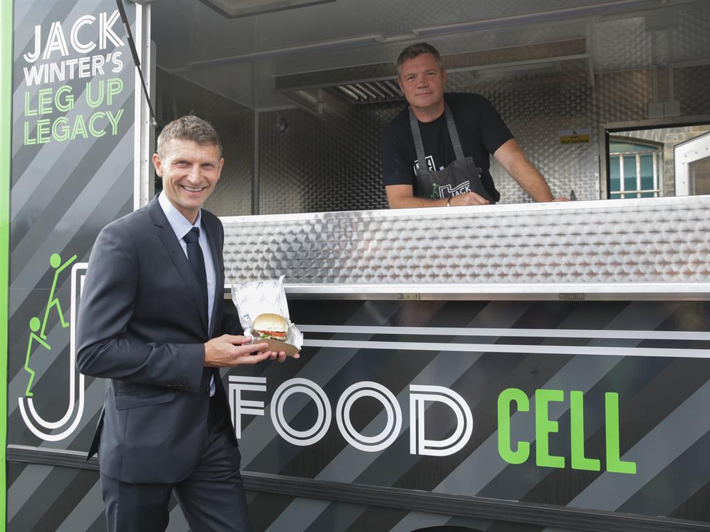 Hungry striker: Ex-Chelsea star Tore Andre Flo at the burger van made from a prison truck