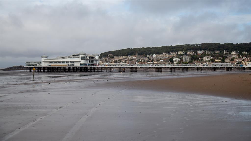 Gloom and doom: The beach at Weston-super-Mare lies deserted as yellow weather warnings are issued around the UK PICTURE: SWNS