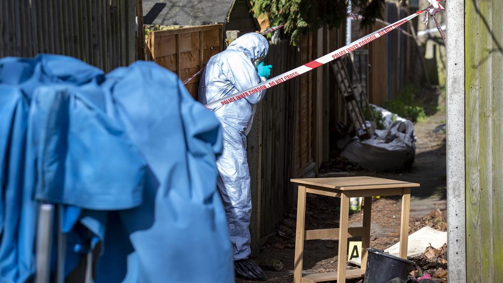 Grim task: A police forensic officer at a property on Darell Road in Kew, south-west London, where Ms Garcia-Bertaux's body was found in March PICTURE: PA