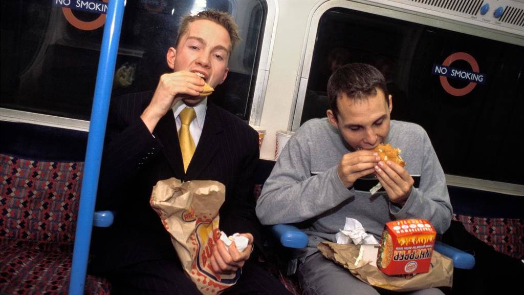 Relish Eating burgers on London Tube