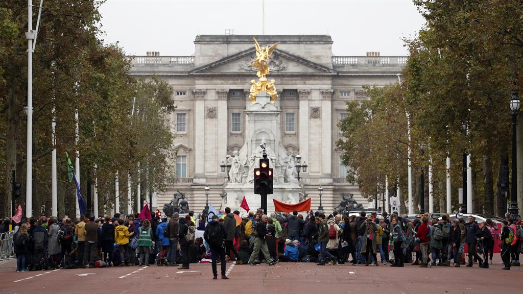 Shout out: Climate protesters block the Mall leading to Buckingham Palace in central London PICTURE: AP