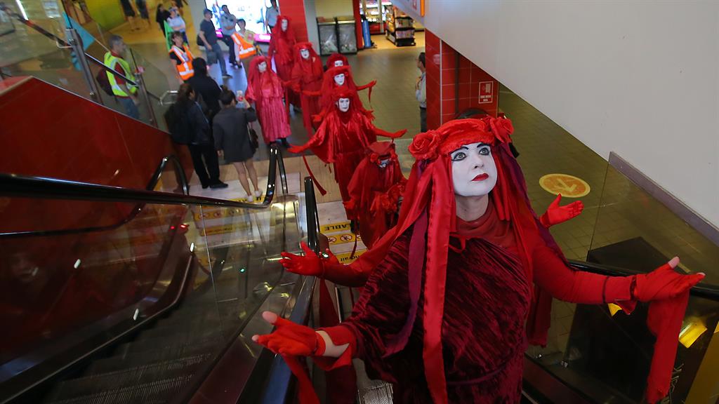 Spring rebellion: Red Rebels participate in a protest at Central Station in Sydney, New South Wales, Australia |PICTURE: EPA