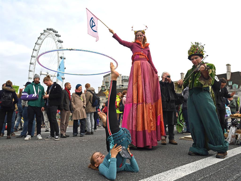 Entertaining the troops: Demonstrators on Westminster Bridge PICTURE: PA