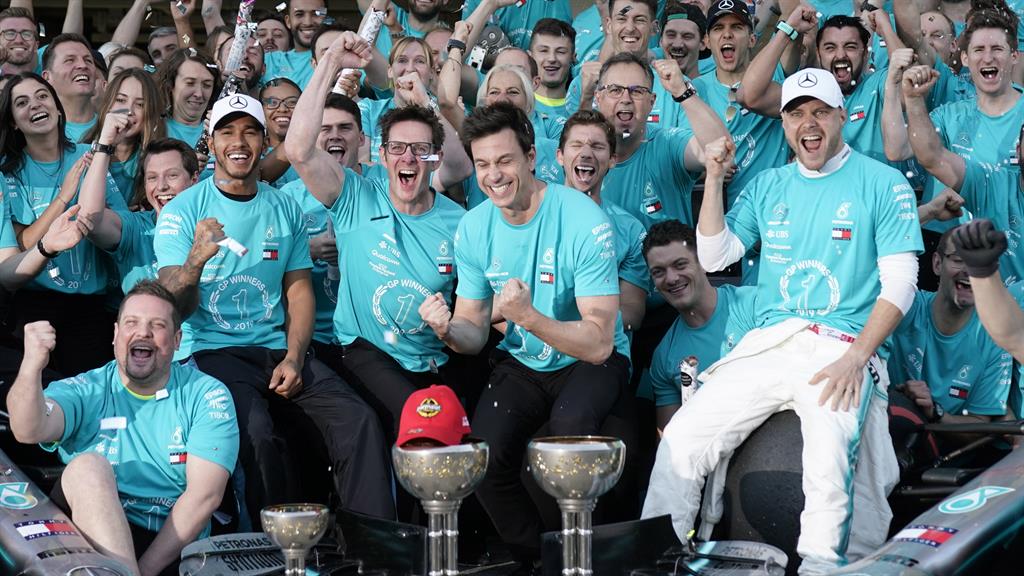 Winners: The Mercedes team celebrate PICTURES: EPA/GETTY