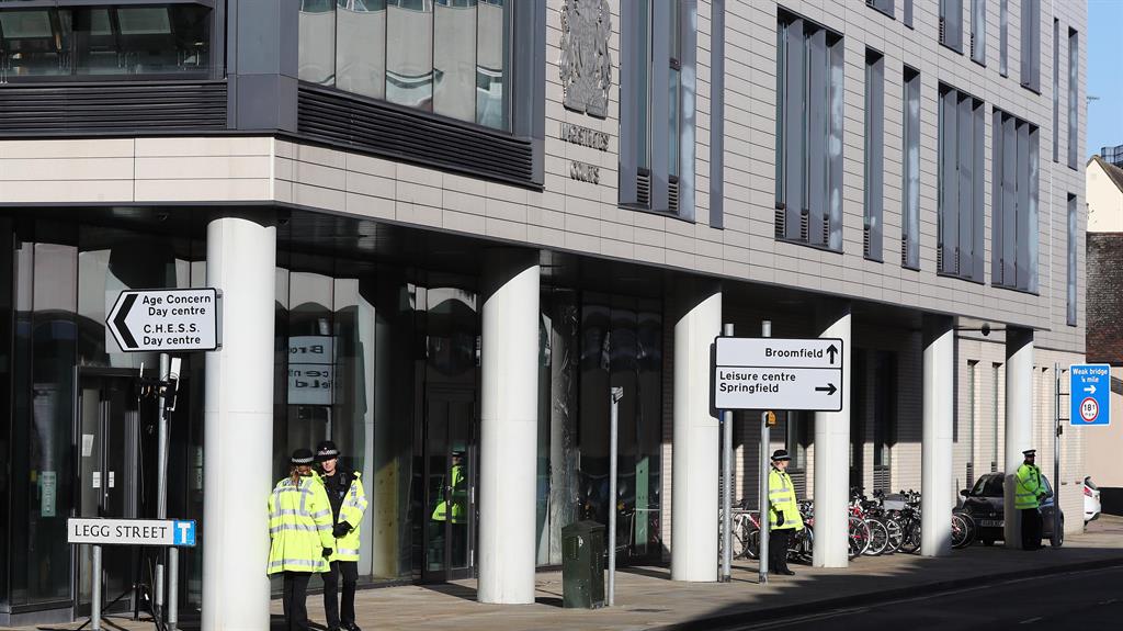 Standing guard: Police outside Chelmsford magistrates' court, Essex PICTURE: PA