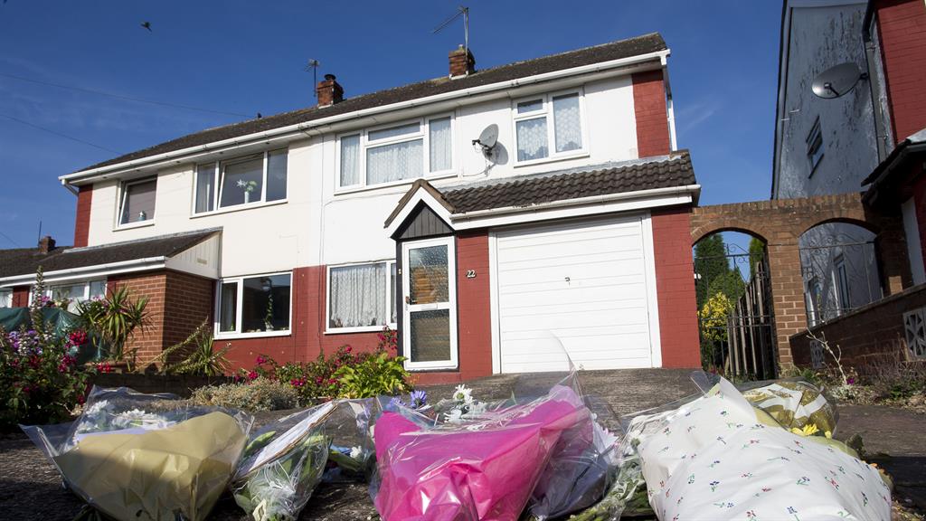 Tributes: Flowers left outside the home of Dalian Atkinson's father in Telford, where the former footballer was killed PICTURE: SWNS