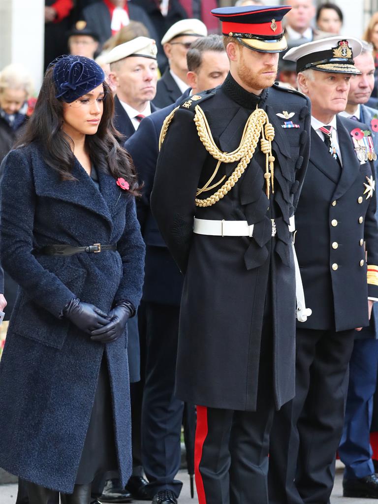Paying tribute: The duke and duchess at the service, and (below) Meghan meeting a veteran soldier