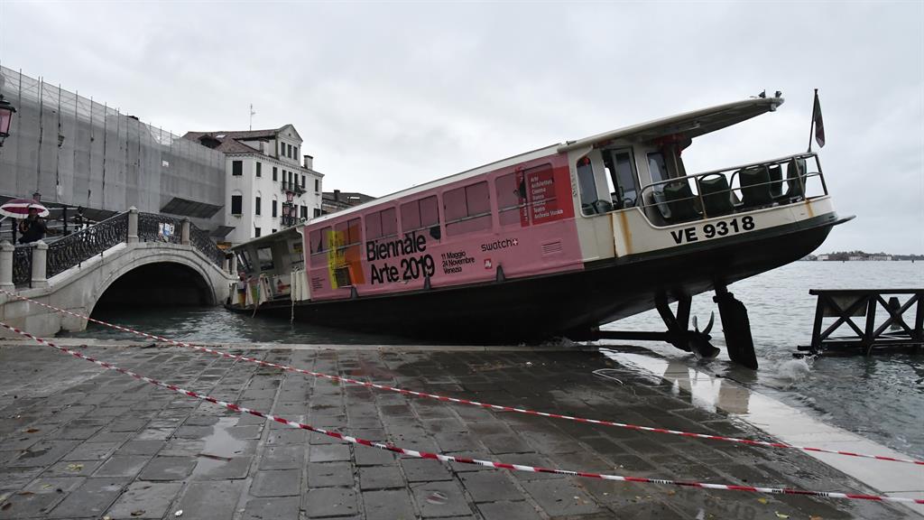 Stranded: A ferry boat lies on its side; and, below, a beached gondola PICTURE: AP