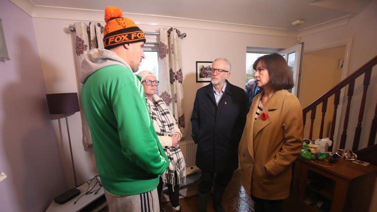 Heartache: Labour leader Jeremy Corbyn and Labour MP Caroline Flint meet residents affected by flooding in Conisborough, South Yorkshire PICTURE: DANNY LAWSON/PA
