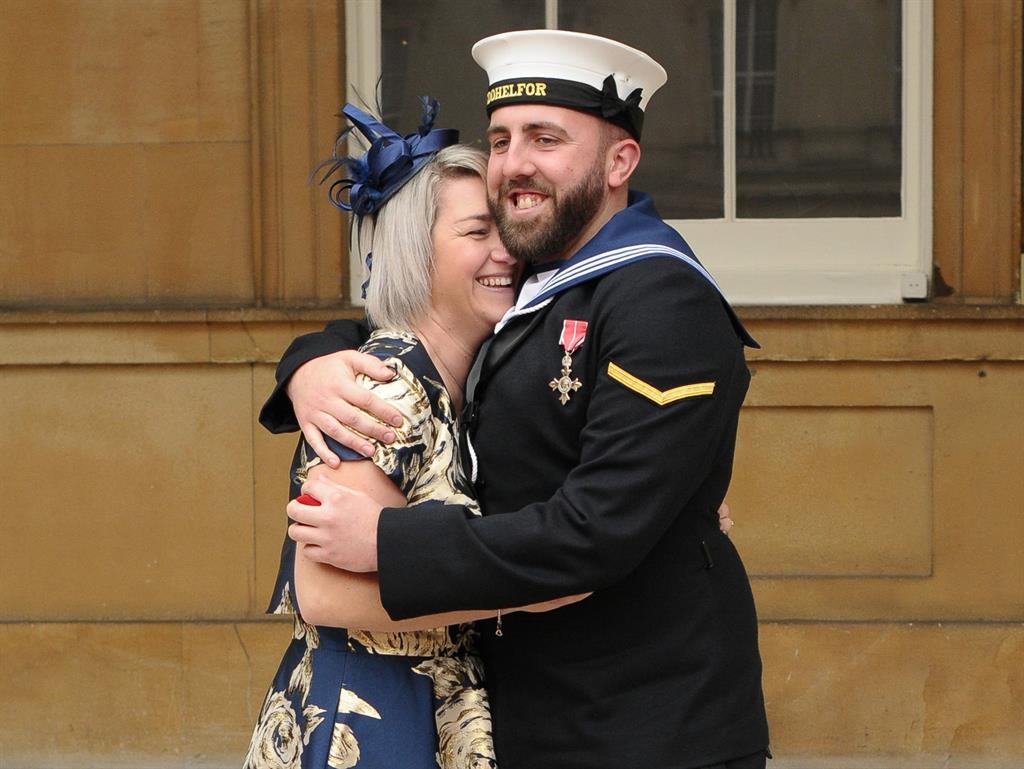 It's a 'yes' from her: Just about over the shock, Adele gets a big hug from hubby-to-be Matthew