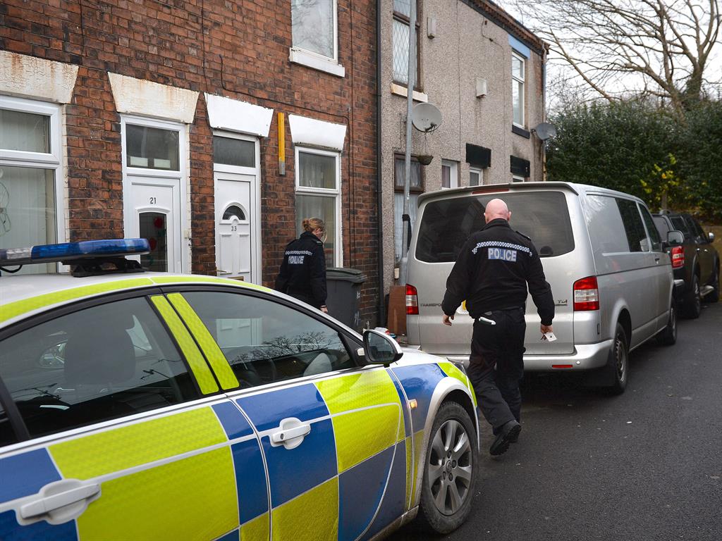 Investigation: Police officers search a property in Stoke-on-Trent in connection with the London Bridge terrorist attack