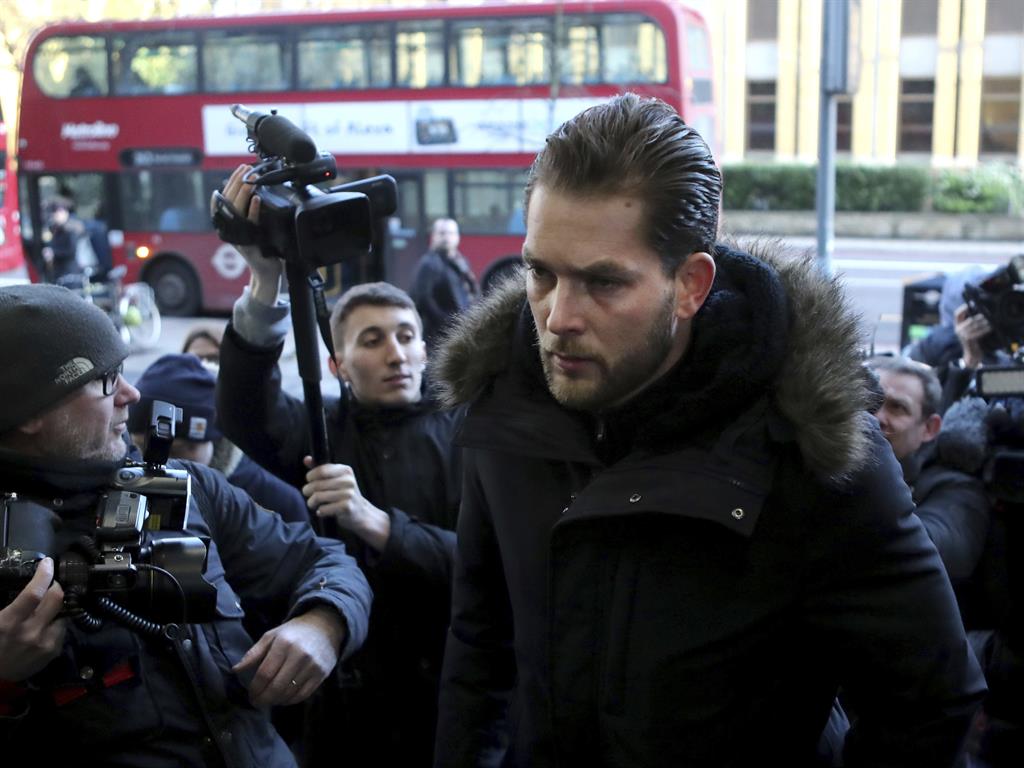 'Assaulted with lamp': Lewis Burton, the partner of Love Island presenter Caroline Flack, arrives at court PICTURE: AP