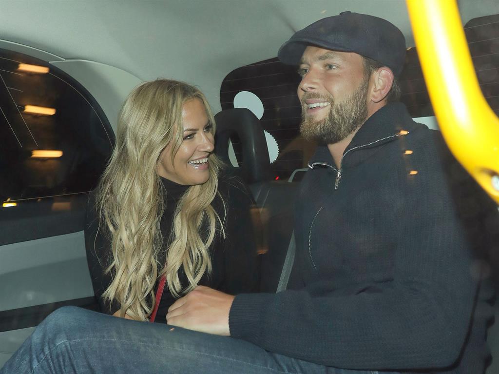 Together: Caroline Flack and Lewis Burton out and about back in October of this year PICTURE: REX