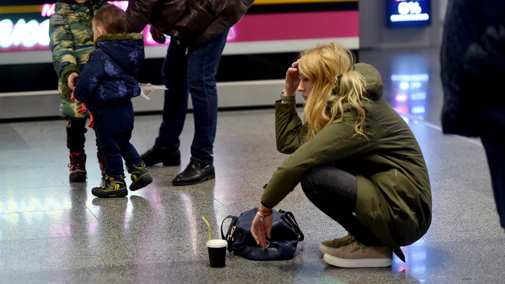 Taking in the news: A woman reacts at the arrival gate of Boryspil airport PICTURE: GETTY