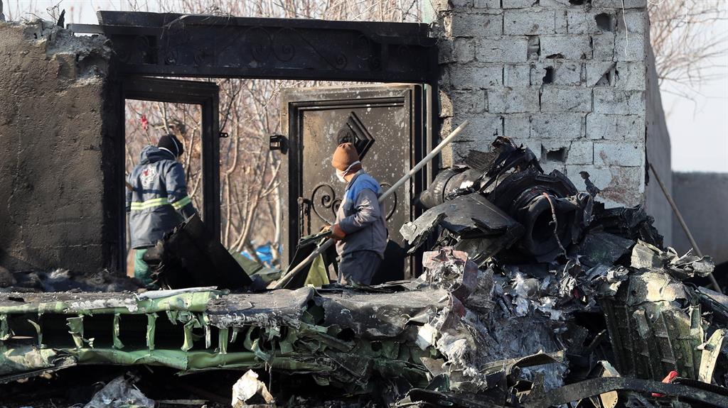 Grim task: Rescue teams work amidst debris PICTURE: GETTY