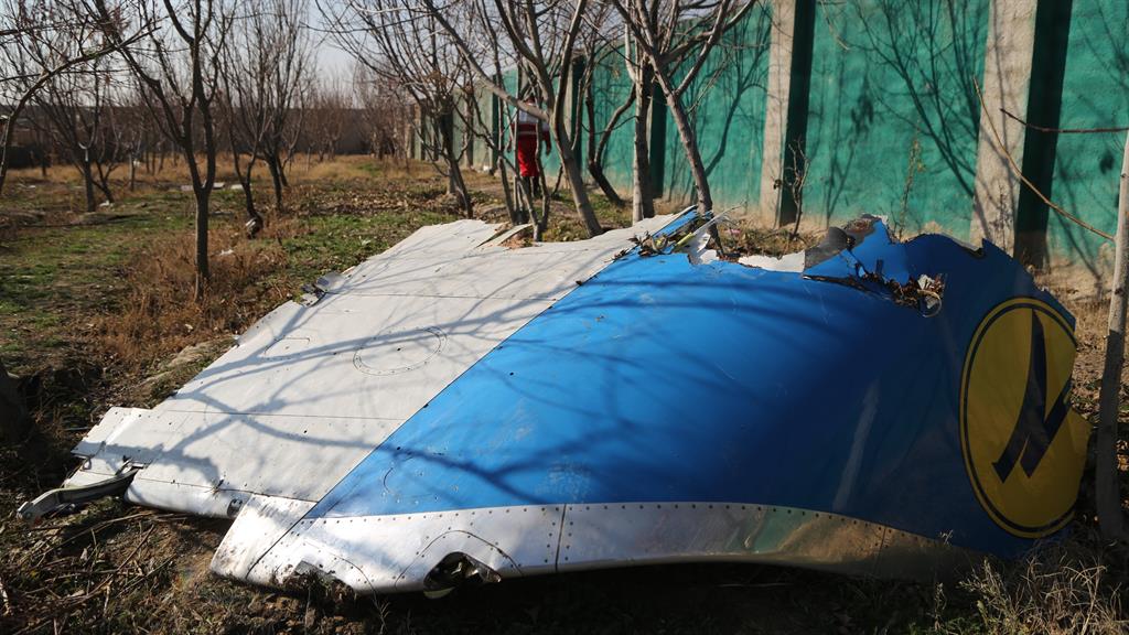 Picking up the pieces: Remains of the plane are seen as search and rescue works are conducted on site PICTURE: GETTY