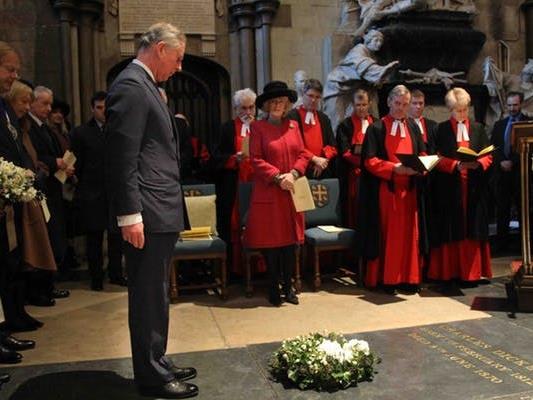 Tributes: The Prince of Wales standing at Dickens’s grave