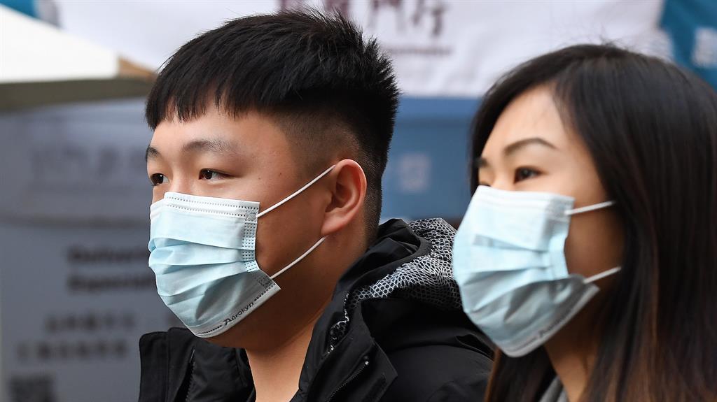 Precautions: People wearing face masks in London PICTURES: EPA/GETTY