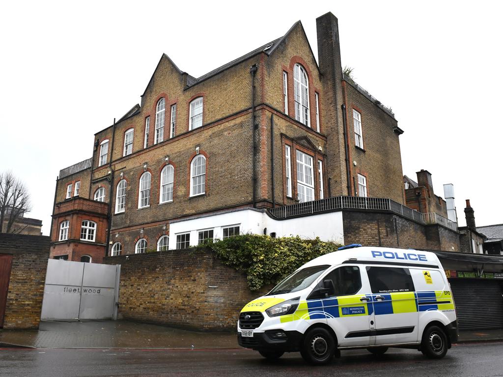 Star's home: Police van parked outside the building where Caroline Flack was found dead at the weekend PICTURE: PA