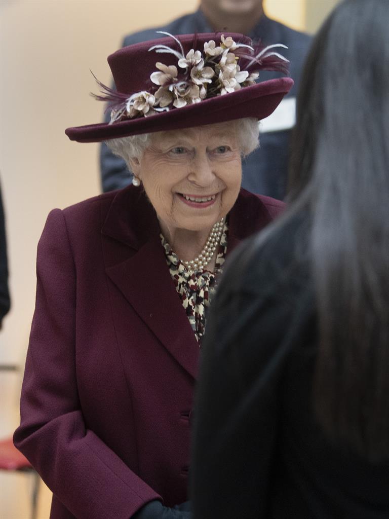 Got our back: Her Majesty chats to an MI5 officer