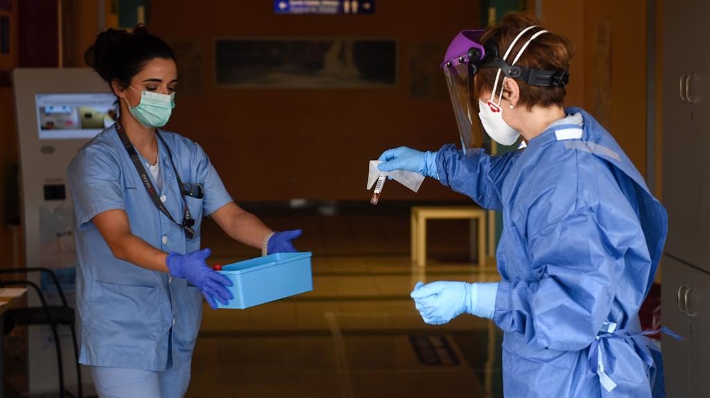 Test drive: Health workers in protective gear collect samples at a drive-through testing centre in San Sebastian, Spain Test drive: Health workers in protective gear collect samples at a drive-through testing centre in San Sebastian, Spain