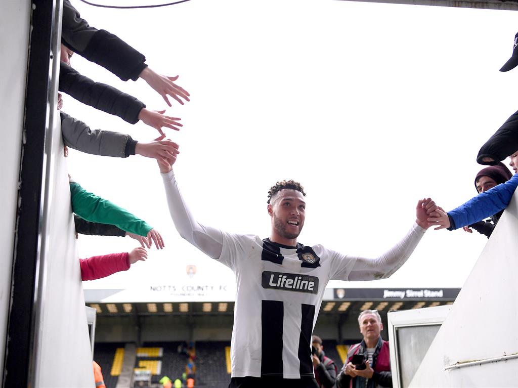 Shaken, not stirred: Goalscorer Wootton ignores public health advice to celebrate with fans PICTURE: GETTY