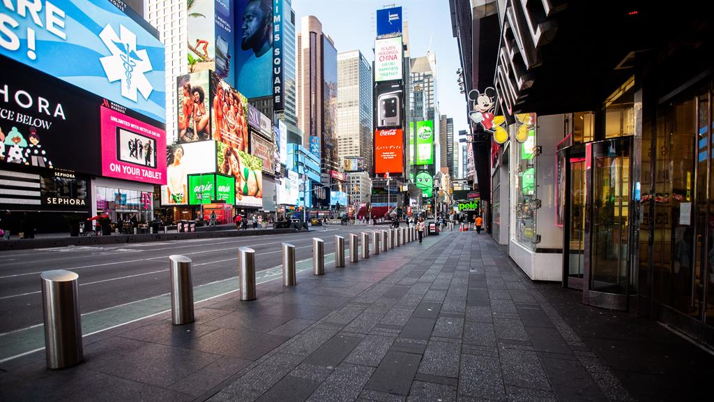 Ghost town: Times Square in New York is deserted as the city struggles to contain the coronavirus outbreak PICTURE: ADE LA LOCONTE/REX