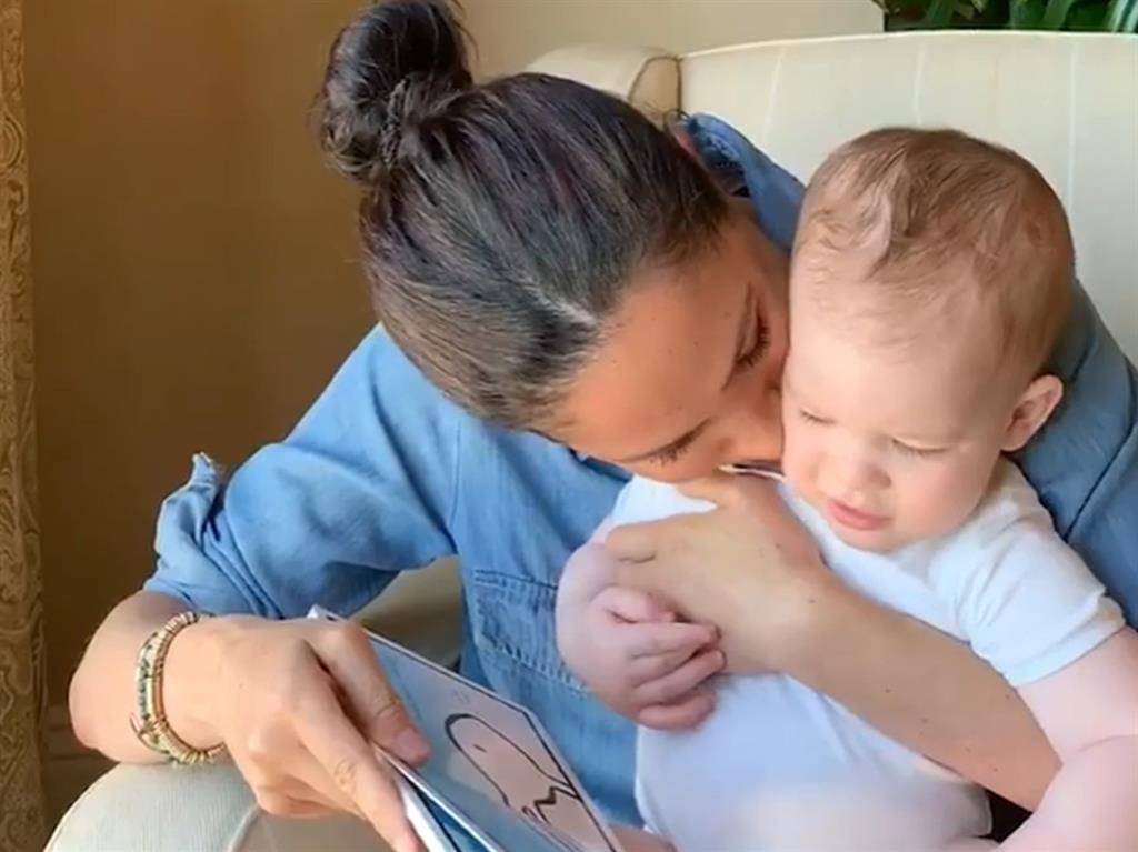 Good job: Archie gets a kiss from mum