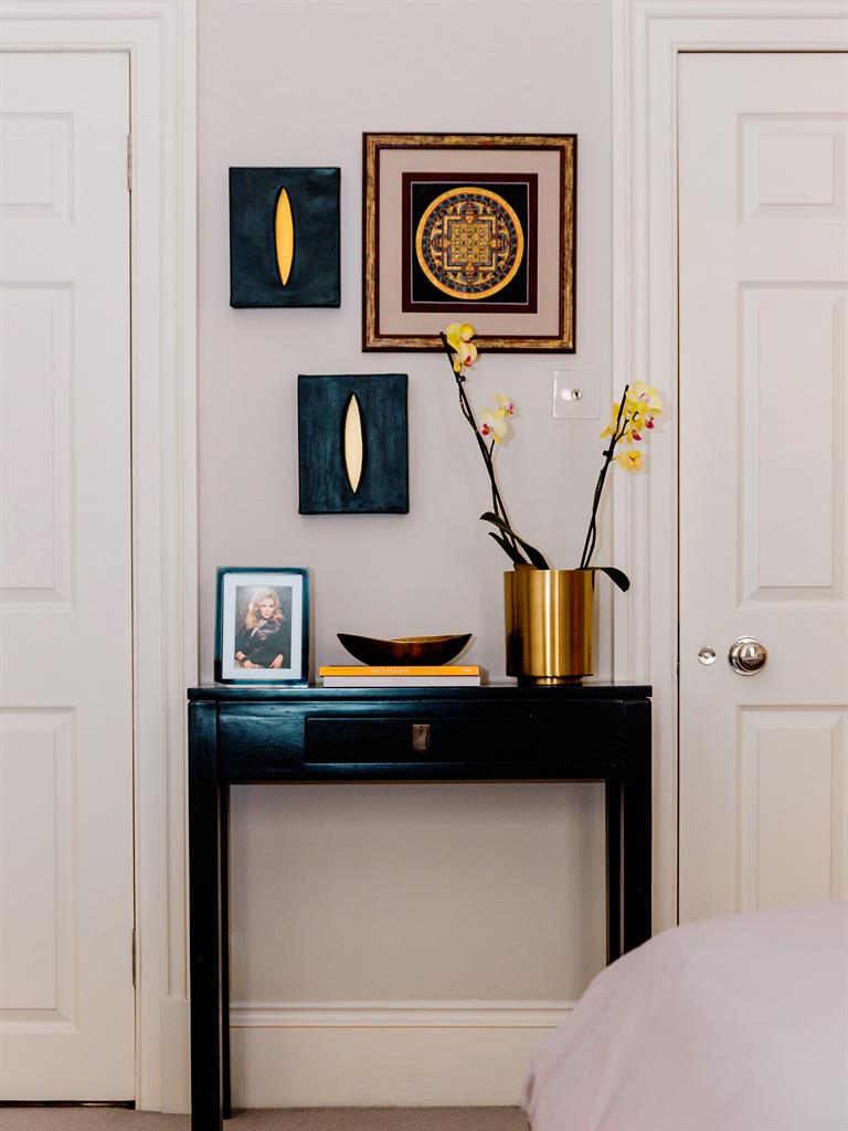 Little touches: Olga uses every corner to show art and her personal mementoes