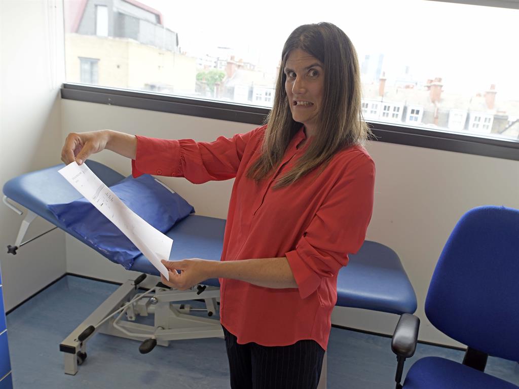 Moment of truth: Sharon Lougher prepares to read her test results