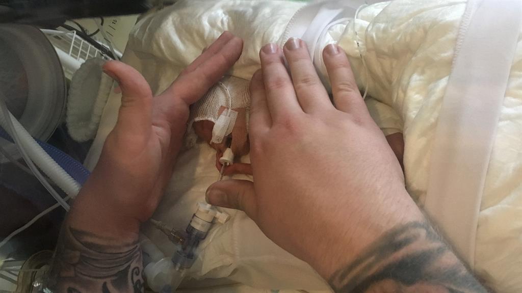 Tiny miracle: Dad Corey with little Clara shortly after she was born prematurely