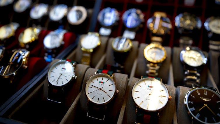 Counterfeit luxuries: ‘Get 'em while they’re hot’ PICTURE: EPA