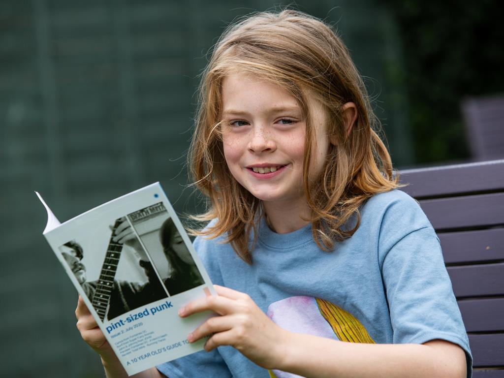 Mini media mogul: Arlo Lippiatt leafs through his publication PICTURES: SWNS