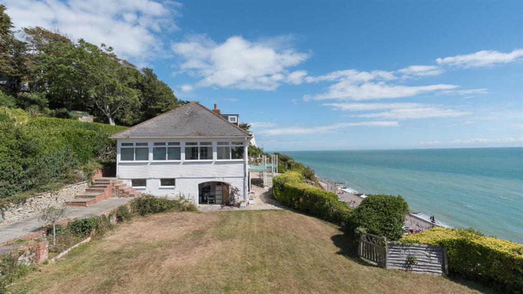 For sale: The £1.4million family home, which Elphicke and his estranged wife Natalie (pictured with him below) bought in 2012