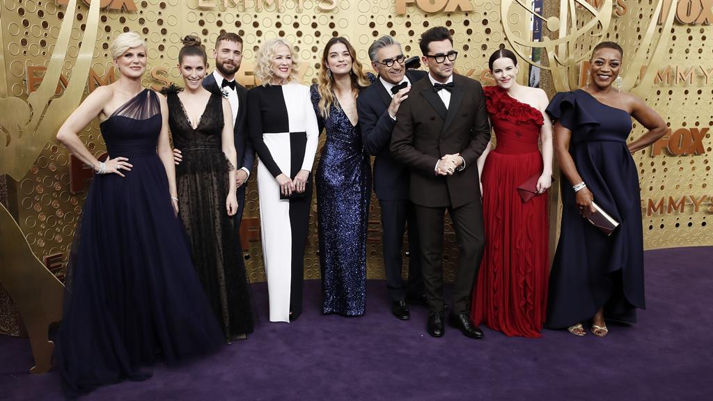 Happy family: Cast members of Schitt's Creek arrive for the awards ceremony held at the Microsoft Theater in Los Angeles, California